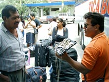 A street vendor offering watches at the Penas Blancas border.